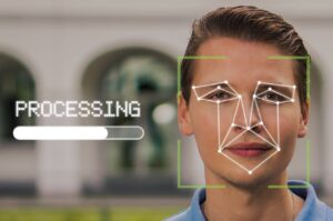 Man having face scanned using biometric recognition system